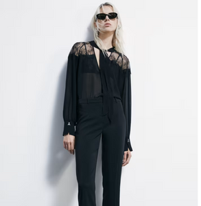 Blusa fluida con fiocco
